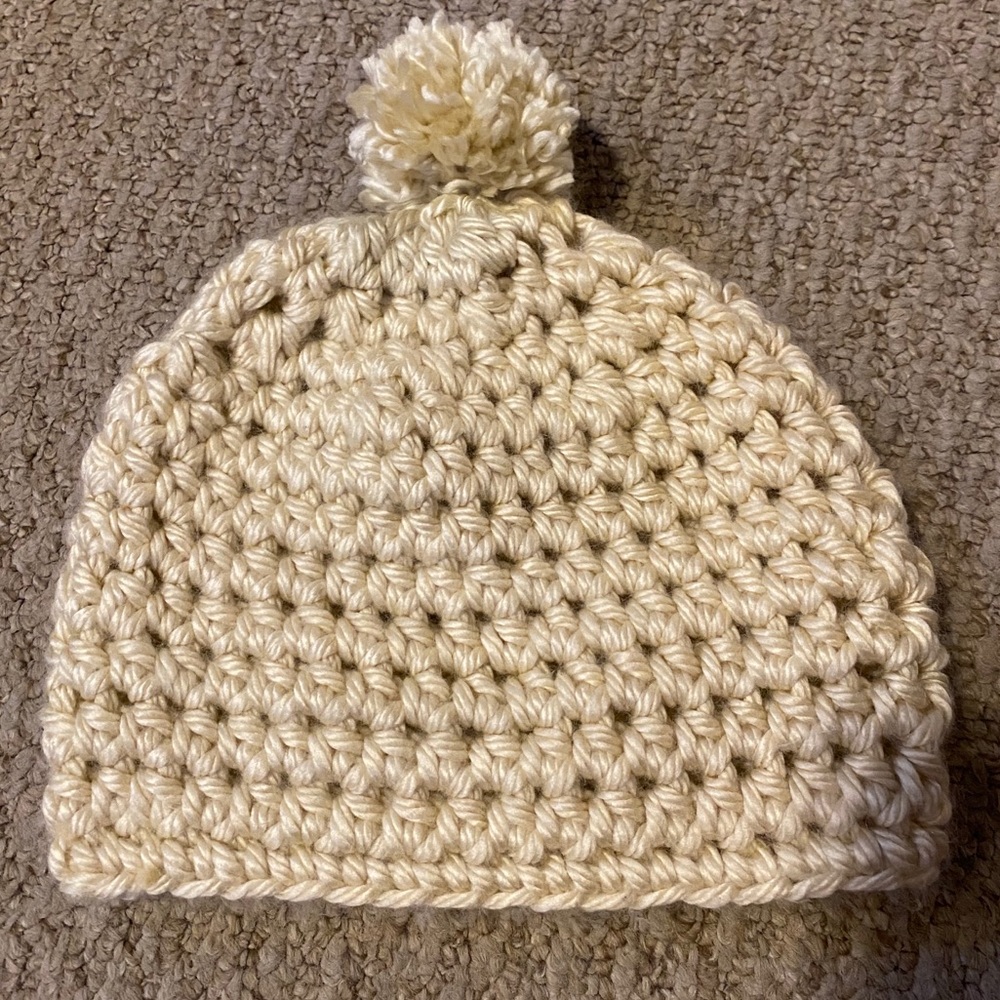 Cream colored winter hat.